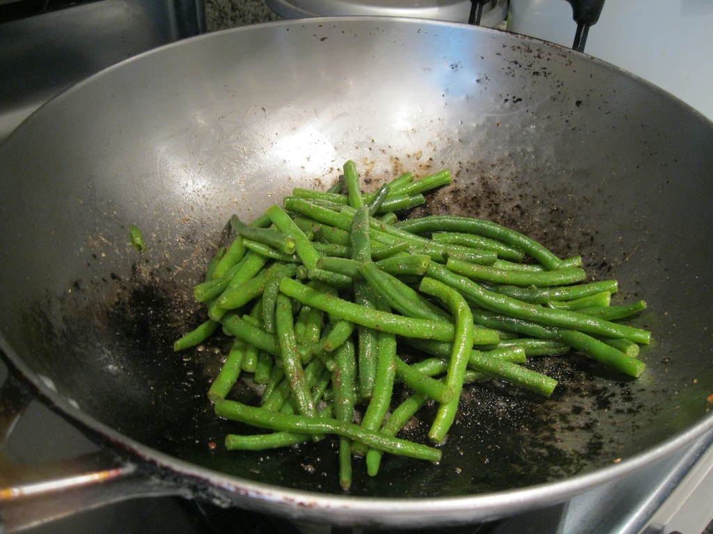 Tossing beans in garam masala butter